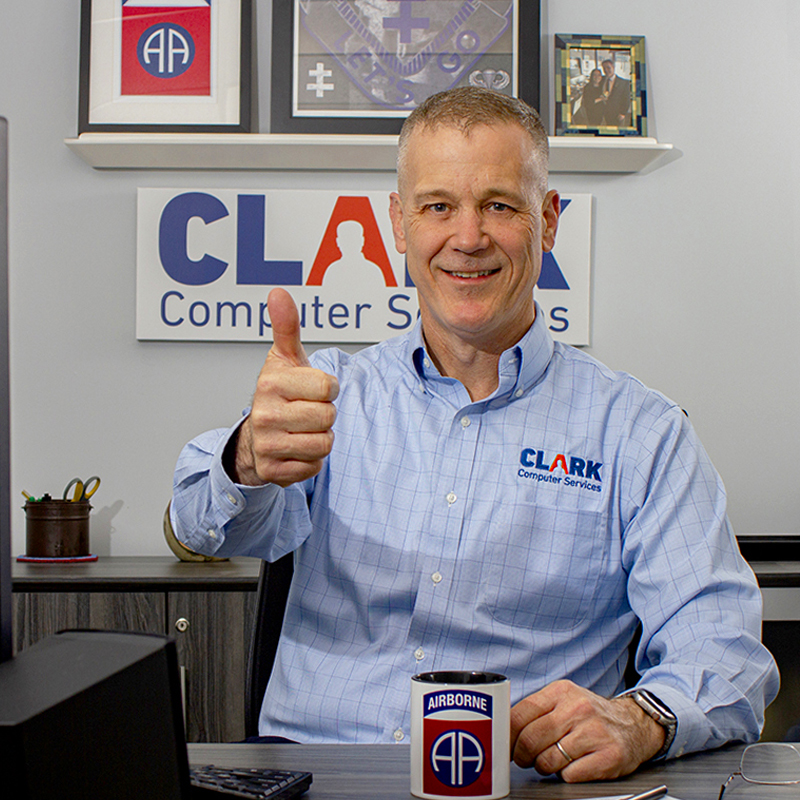 Our Team | Always Responsive, Professional, and Friendly | Clark Computer Services IT Support Services Leadership Page Darren Clark in his office