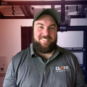 Our Team | Always Responsive, Professional, and Friendly | Our Team | Always Responsive, Professional, and Friendly | Clark Computer Services - Our Team - RJ in front of cabling