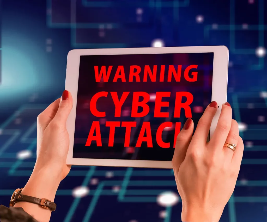 5 Steps to Better Cybersecurity | Chuck's Cyber Wall | 5 Steps to Better Cybersecurity | Chuck's Cyber Wall | Chuck's Cyber Wall - 5 Steps to better Cybersecurity warning of cyber attack on tablet held by woman.