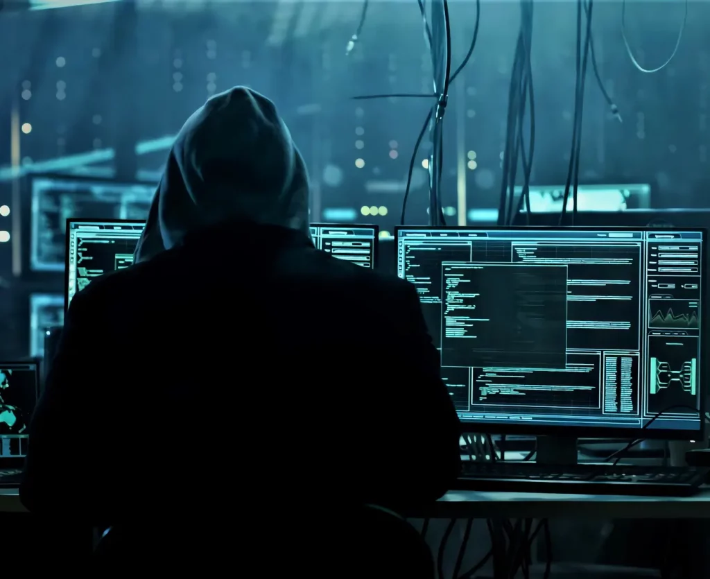 5 Steps to Better Cybersecurity | Chuck's Cyber Wall | 5 Steps to Better Cybersecurity | Chuck's Cyber Wall | Chuck's Cyber Wall - 5 Steps to better Cybersecurity image of a hacker sitting in front of a scary setup.