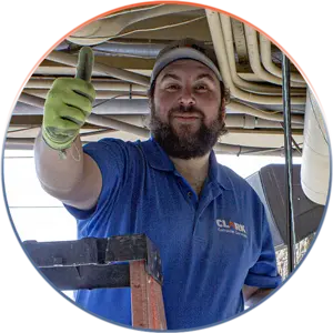 Our Team | Always Responsive, Professional, and Friendly | Our Team | Always Responsive, Professional, and Friendly | Our Team image of RJ standing on a ladder running cabling giving a thumbs up.