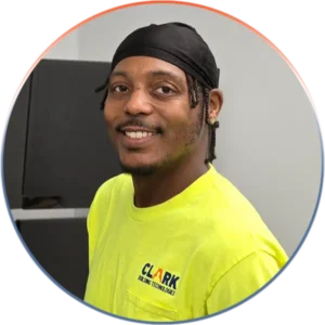 Our Team Provides the Best Professional Responsive and Friendly Service | Our Team Provides the Best Professional Responsive and Friendly Service | Clark Building Technologies Our Team page, image of Brian in front of monitor wall.